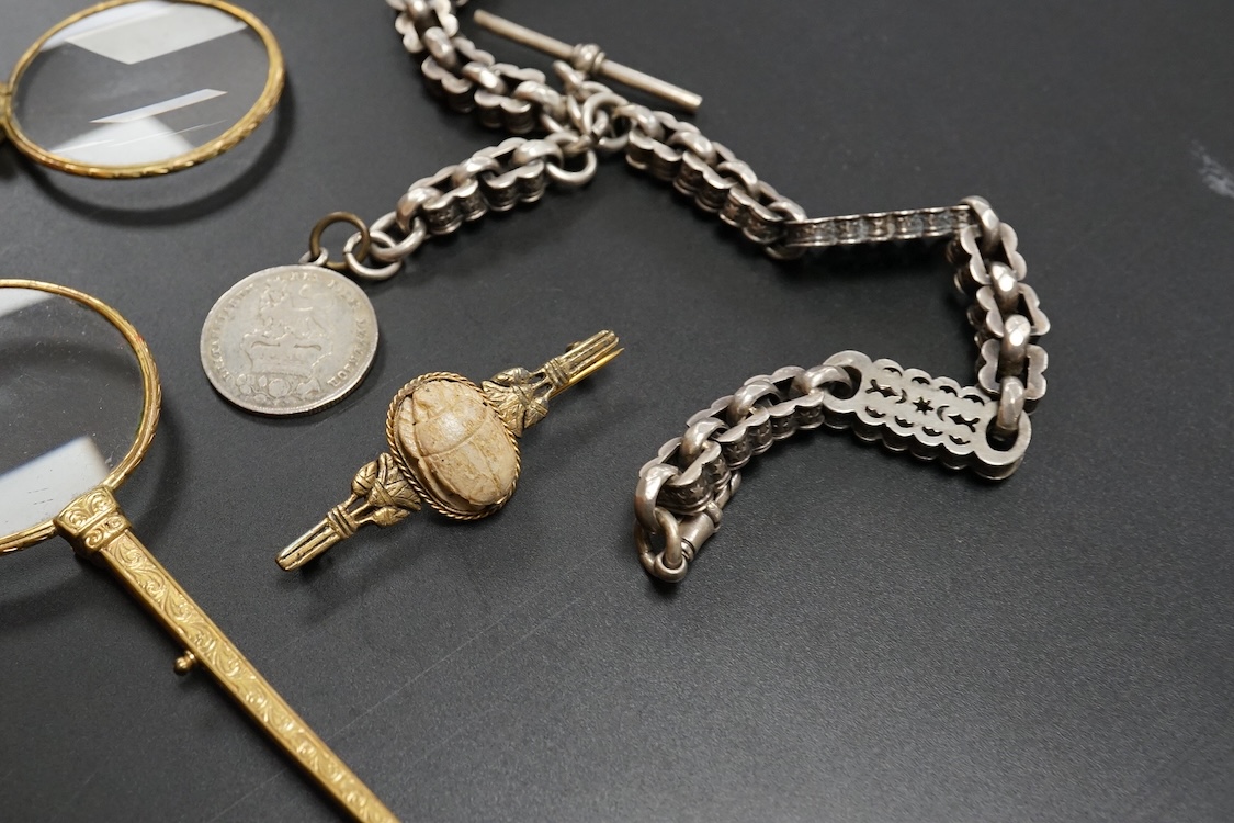 A small group of assorted jewellery and other items including a Victorian white metal albert, hung with a silver vesta case, a pair of gilt metal lorgnettes, cufflinks, scarab brooch and a white metal propelling pencil,